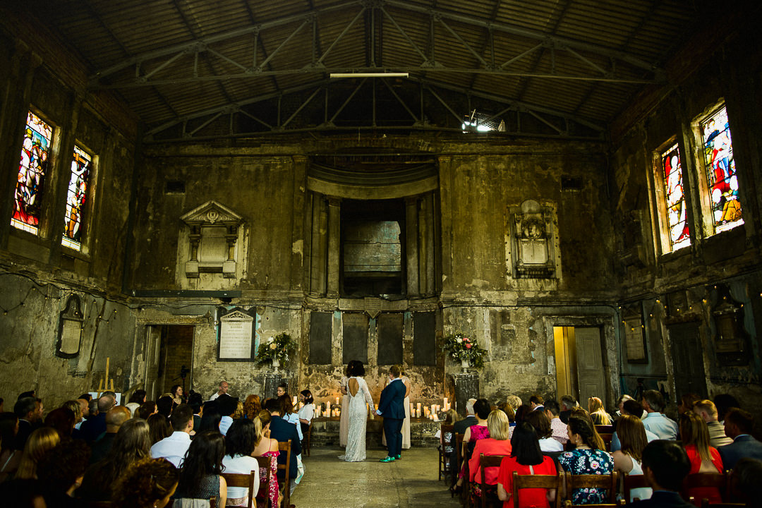 wide shot of same sex wedding at the asylum chapel