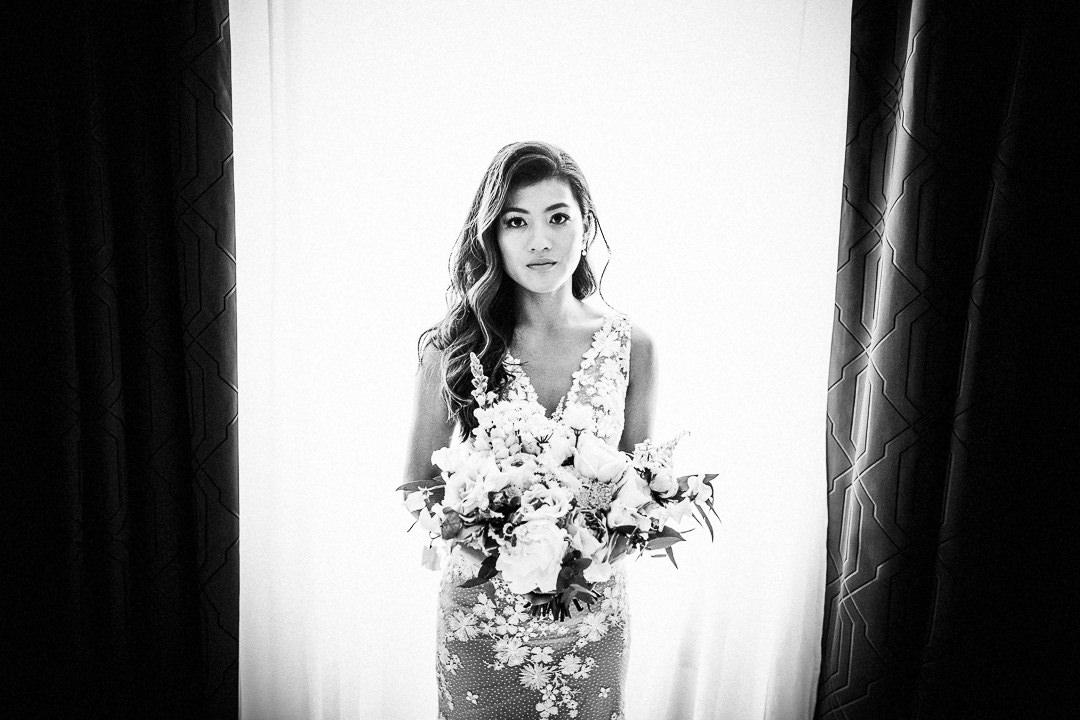 bride in wedding dress holding wedding bouquet