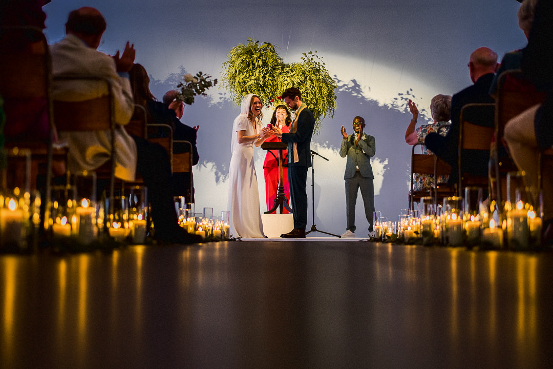 a low angle shot of the candlelit wedding aisle at Shoreditch Studios